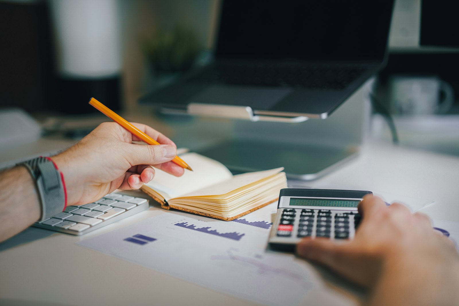 Pricing — Grow Bees Calculator and notebook on a desk, representing transparent pricing and budget planning